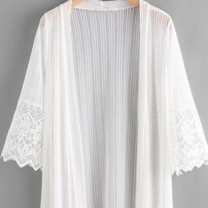Embroidered Mesh Panel Fringe Hem kimono.